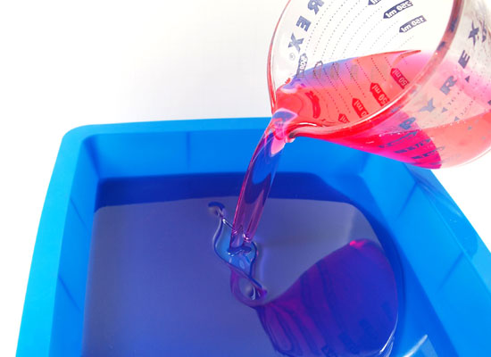 pour red soap into silicone baking pan