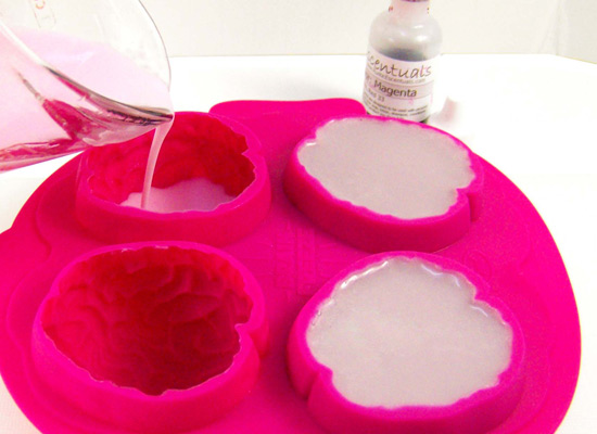 pour pink soap into 1 cavity