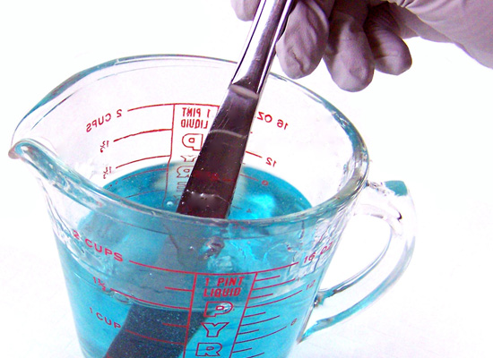 stirring blue into soap