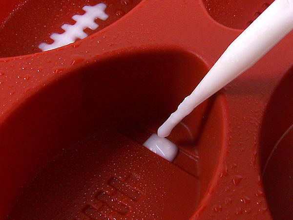 fill the small cavities in the bottom of the mold