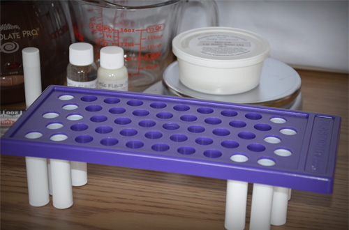 insert tubes into filling tray