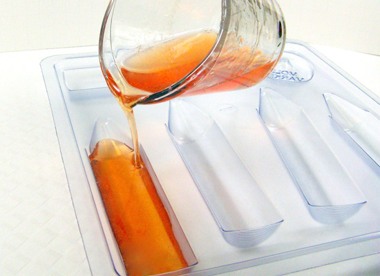 pour orange soap slowly into cavity