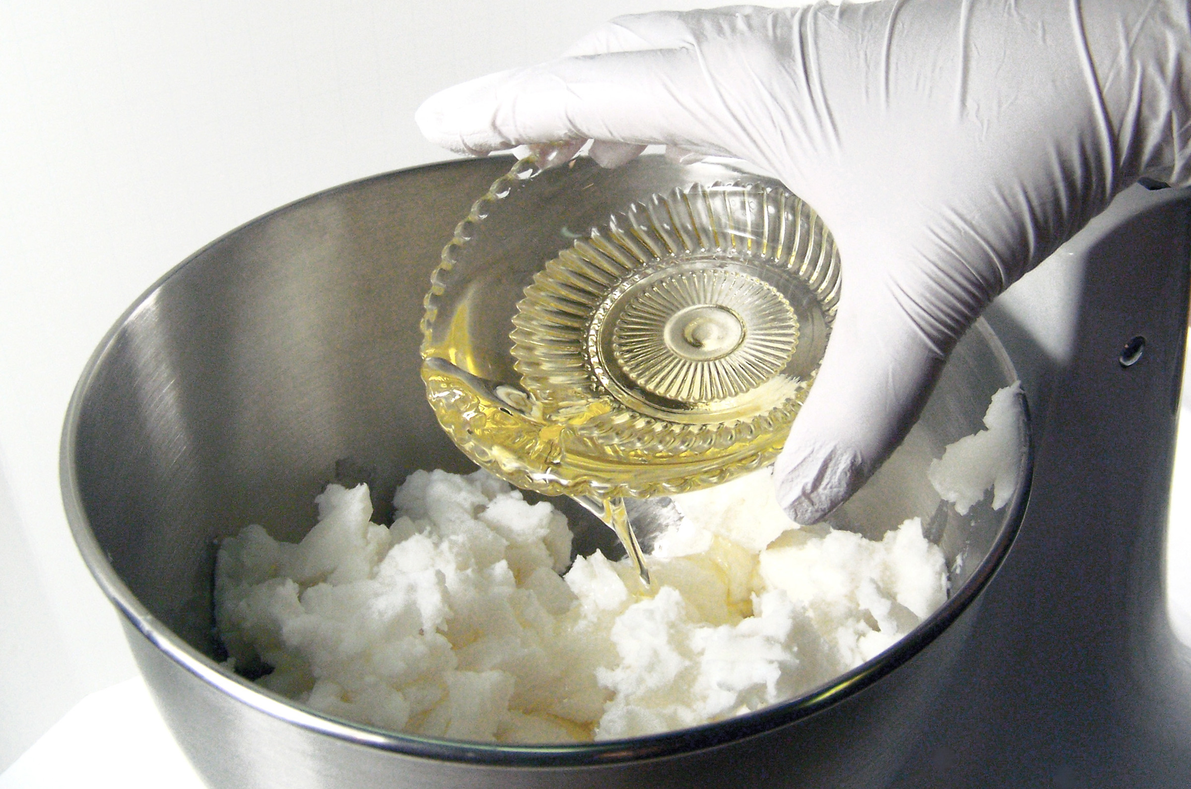 add warm oil to foaming bath butter